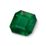 Faceted Swat Emerald gemstone in rectangular shape with beveled edges, showcasing rich green color and internal clarity—representing cultural legacy and emotional resonance.
