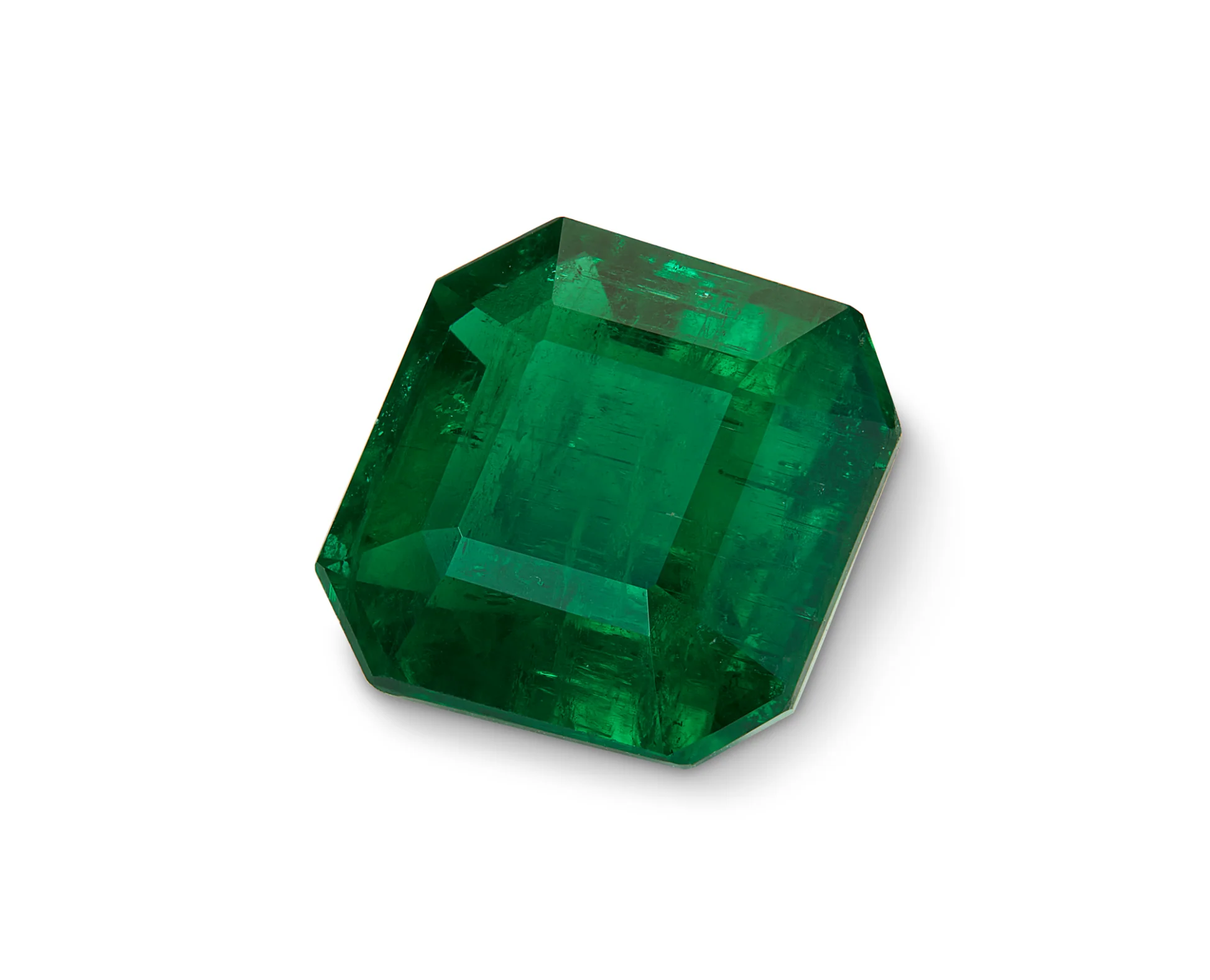 Faceted Swat Emerald gemstone in rectangular shape with beveled edges, showcasing rich green color and internal clarity—representing cultural legacy and emotional resonance.
