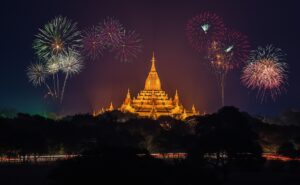 A radiant temple illuminated beneath a night sky of fireworks—symbolizing joy, reverence, and the spiritual beauty of sacred occasions.